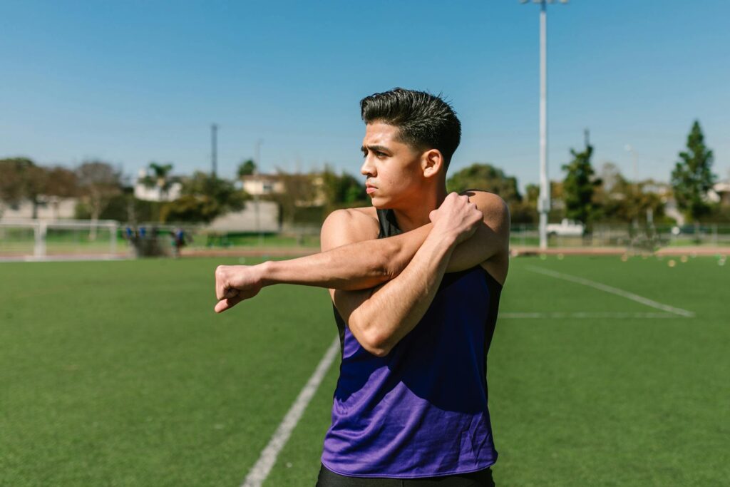 student exercising in park