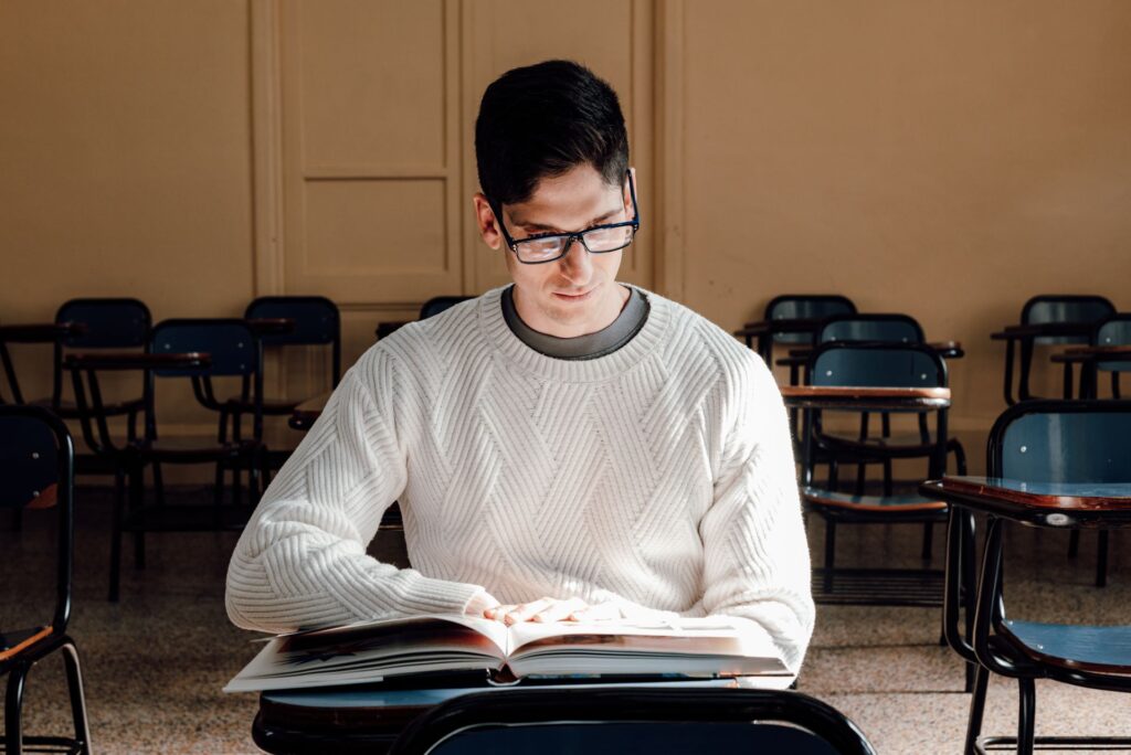 a student is reading book in class