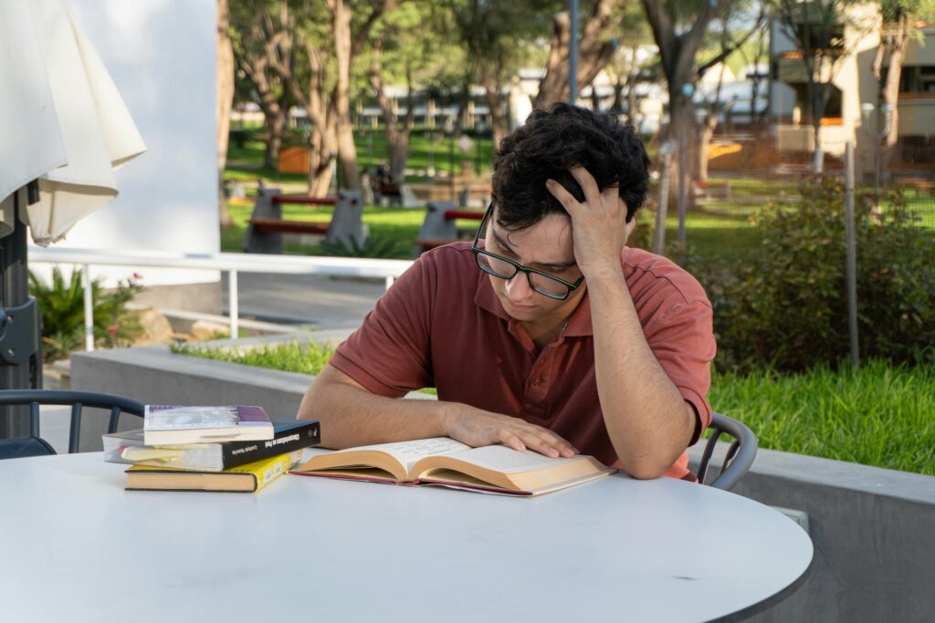 a boy is reading a book