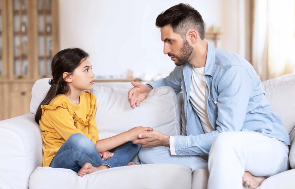 father talking to his daughter 