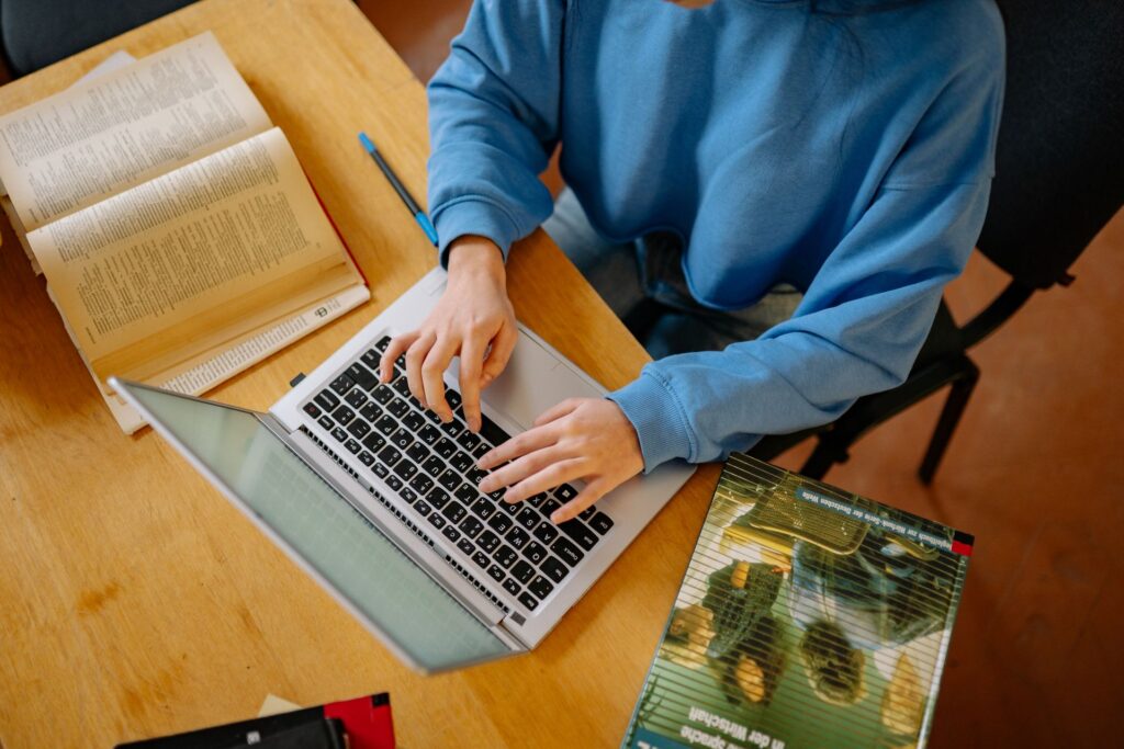 a boy using laptop