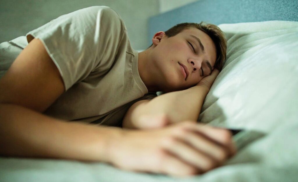 student sleeping on bed
