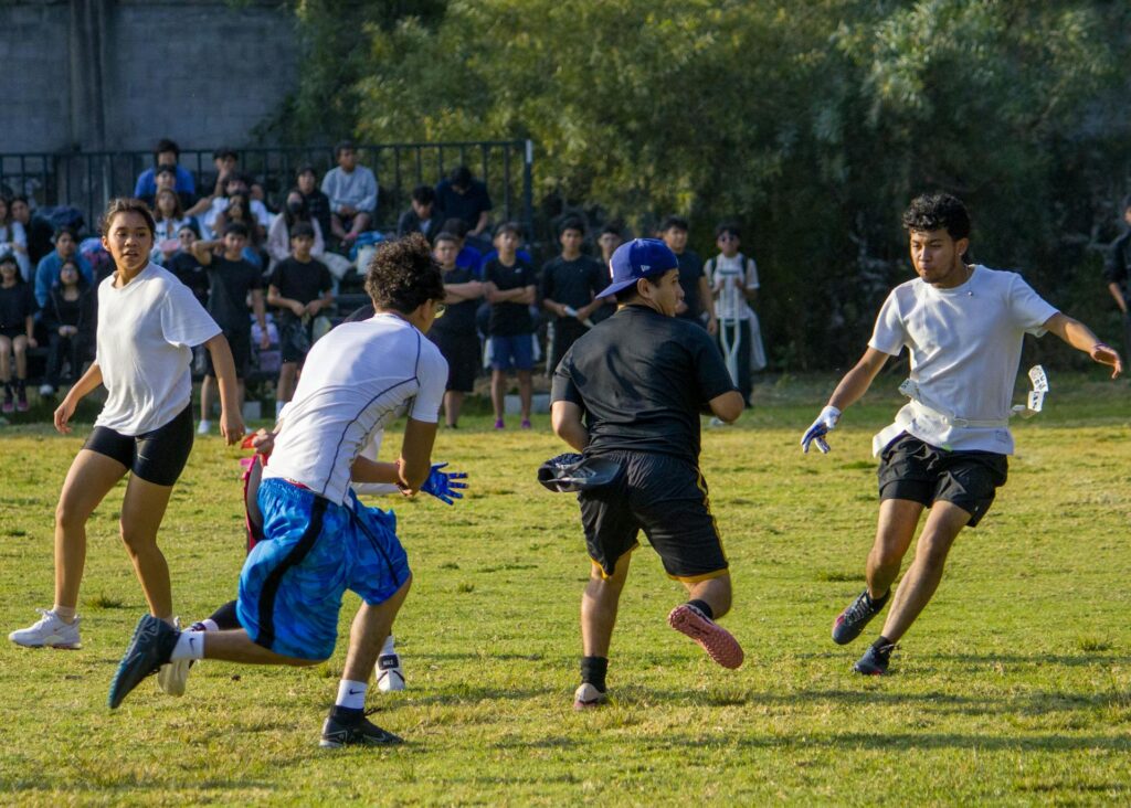 students playing football