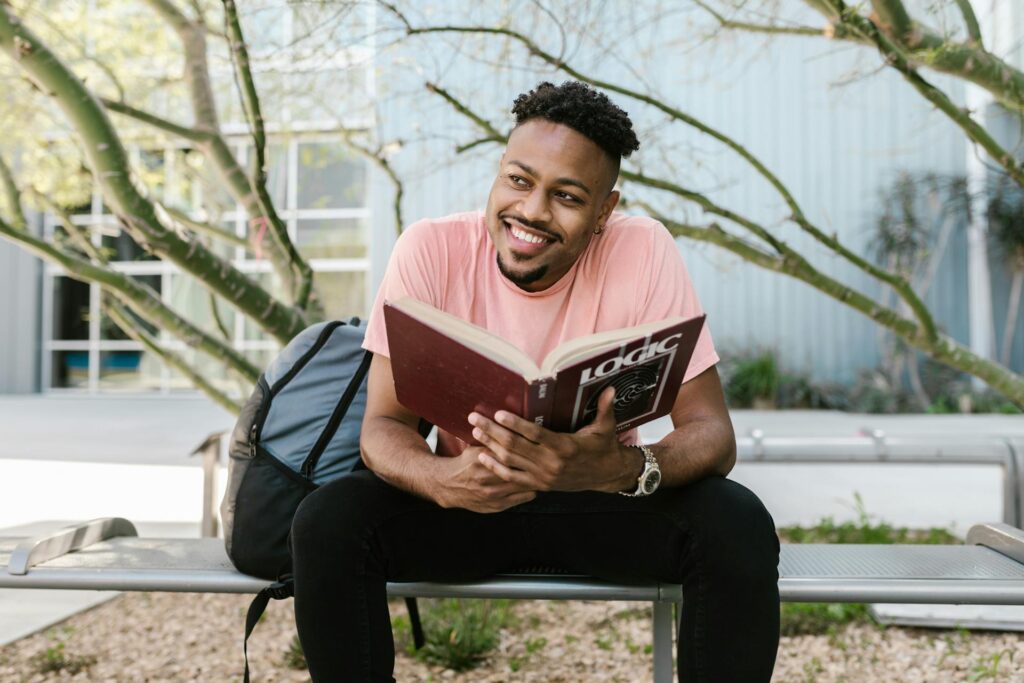 student smiling while reading
