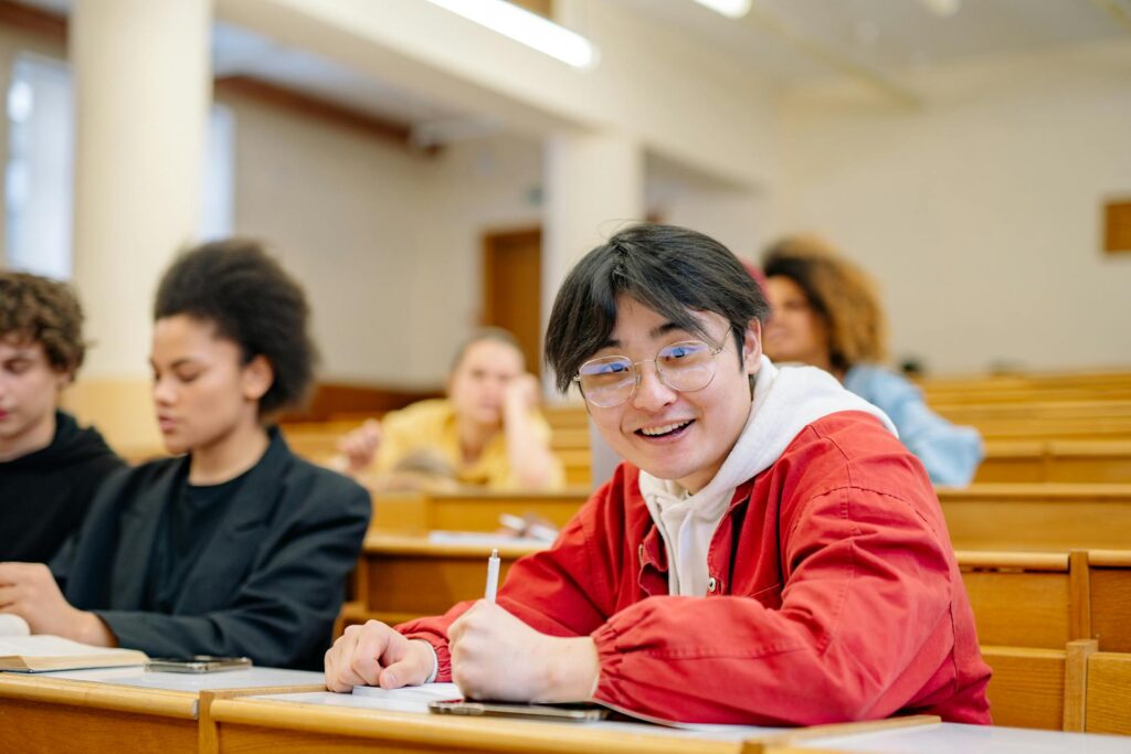 student in class smiling