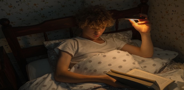 a student reading at night 